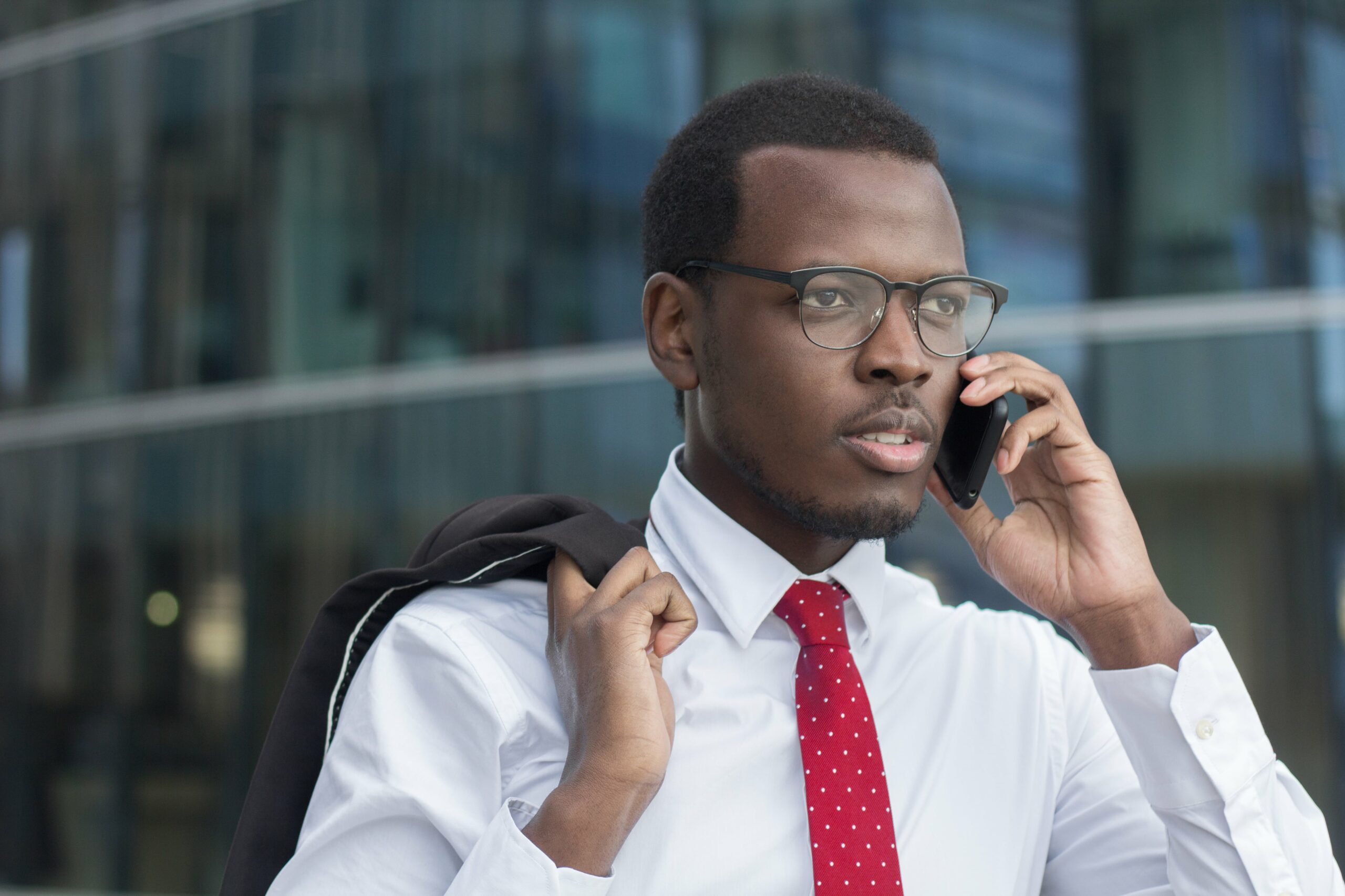 young-confident-african-businessman-discusses-busi-2024-10-18-04-01-24-utc-min